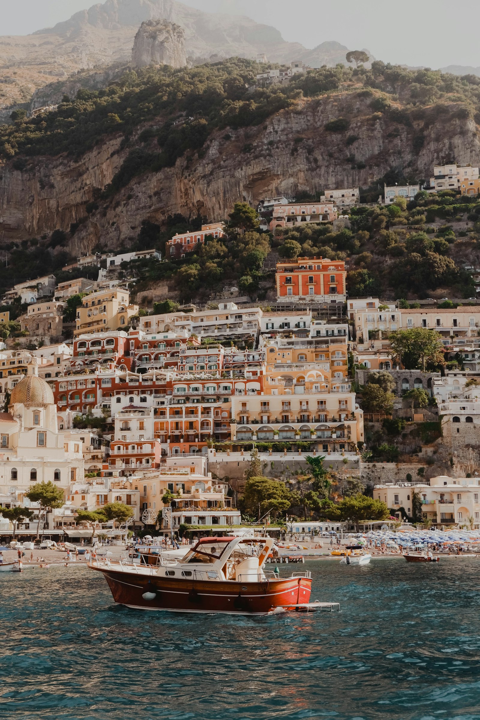 A sea-view restaurant terrace on the Amalfi Coast at sunset