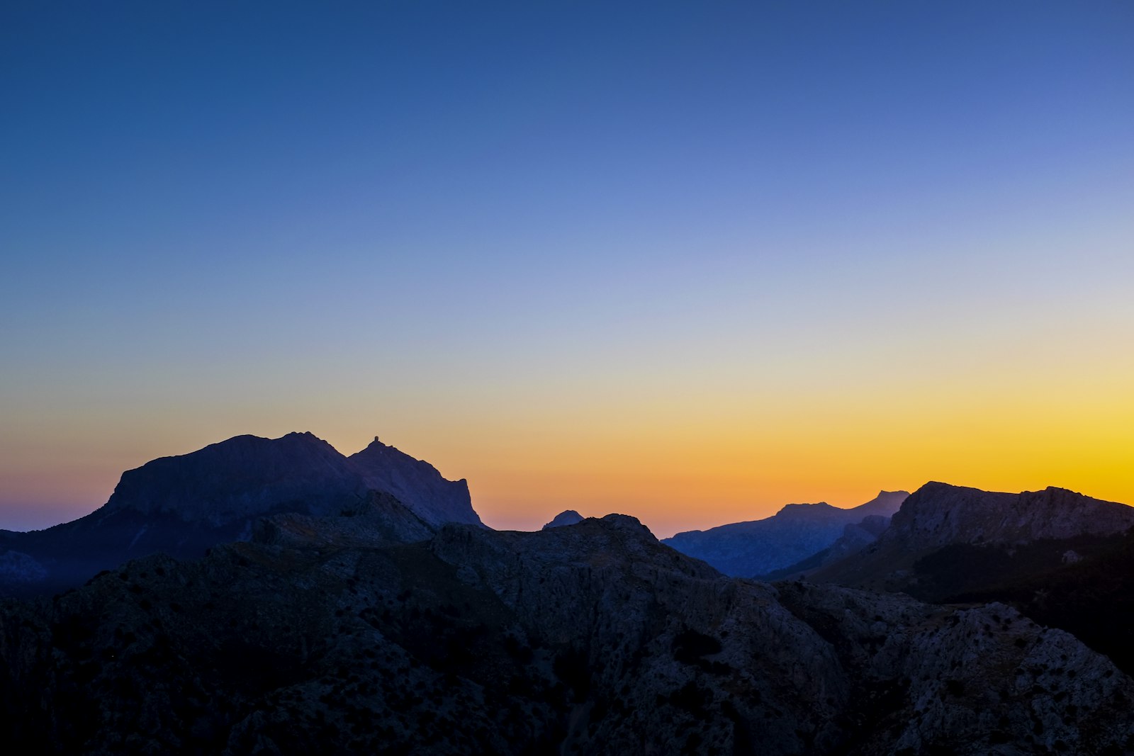 The Serra de Tramuntana mountains in silhouette