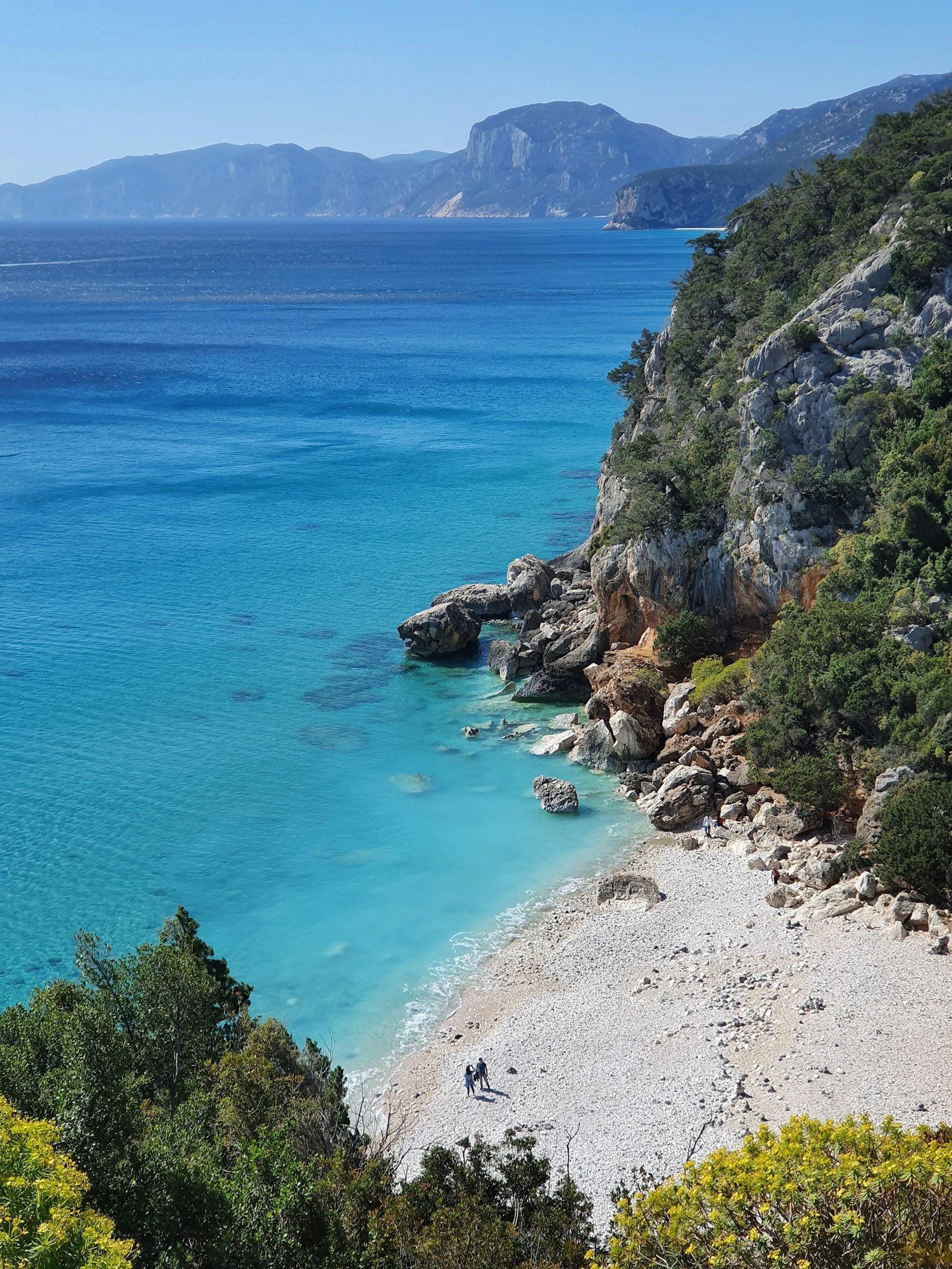 A turquoise cove in southern Sardinia seen from above
