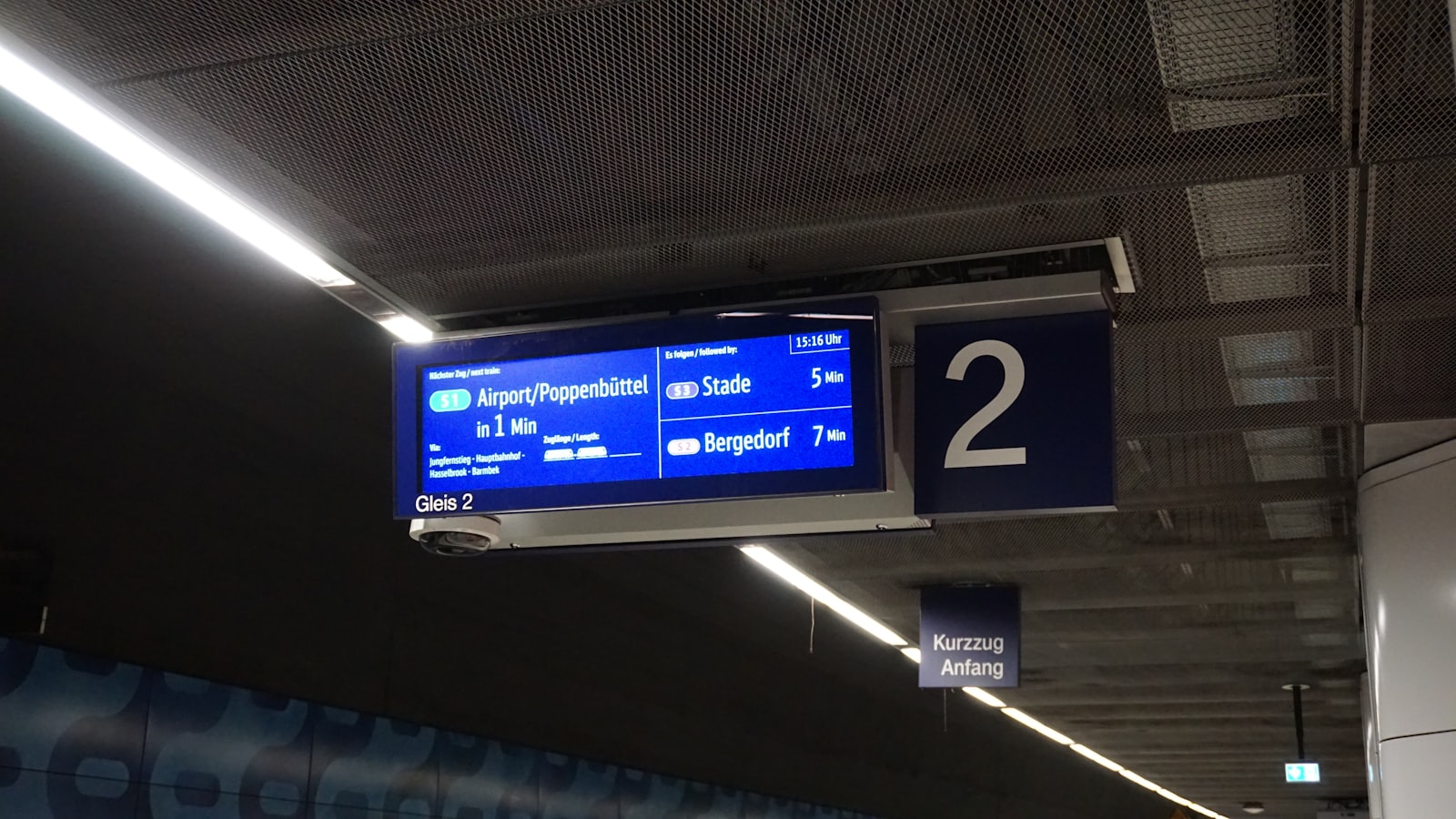 Departures board hanging over the concourse of a railway station