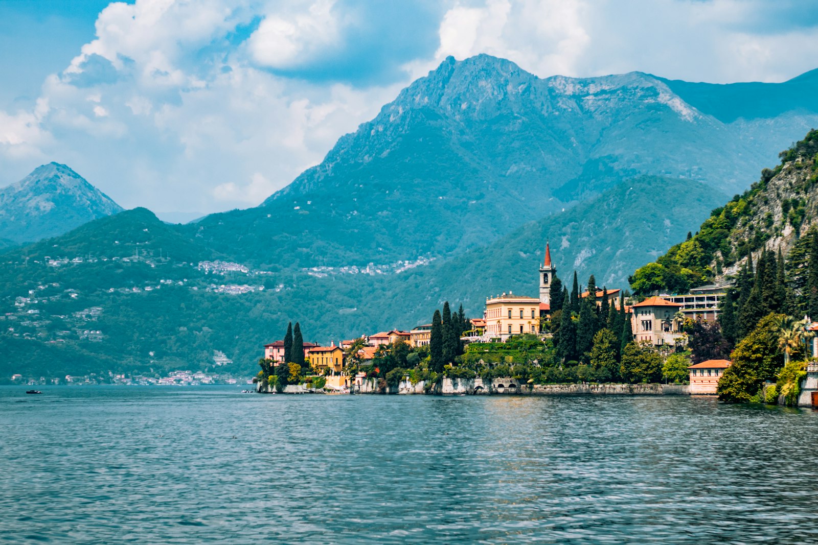A lakeside town on Lake Como with mountains behind