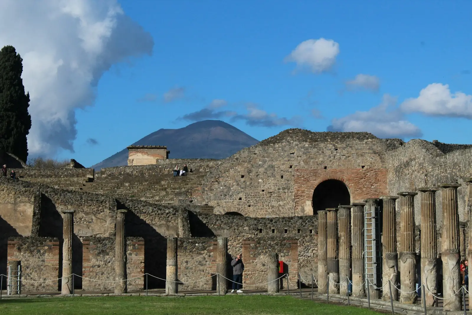Columns among the ruins of Pompeii, with a mountain in the distance